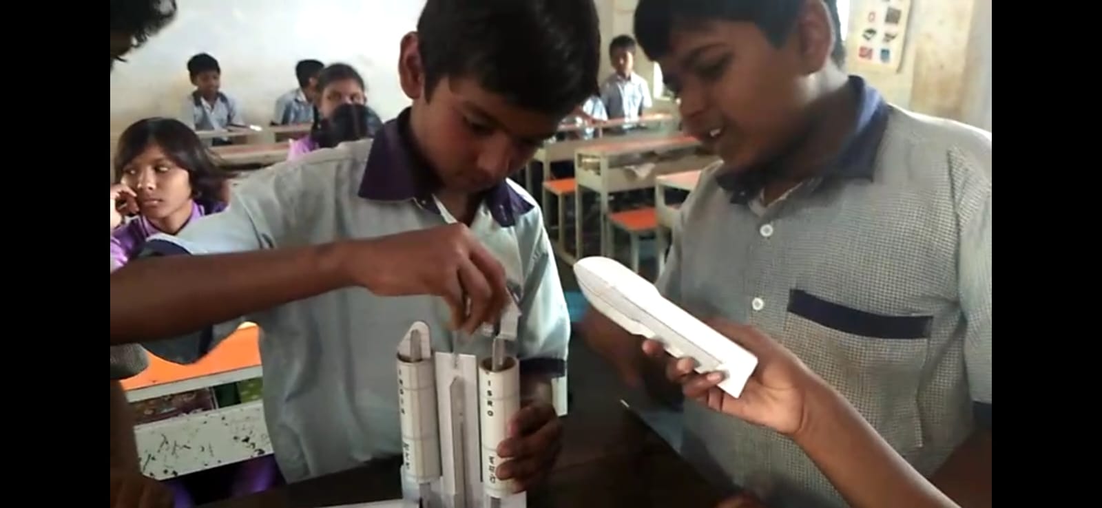 Students building rocket models during a Creators session